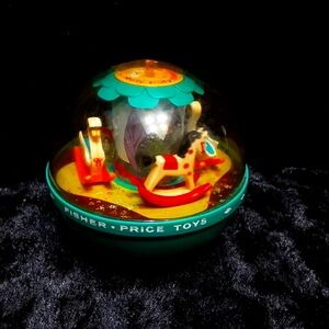 The Vintage Fisher Price Roly Poly Chime Ball #165